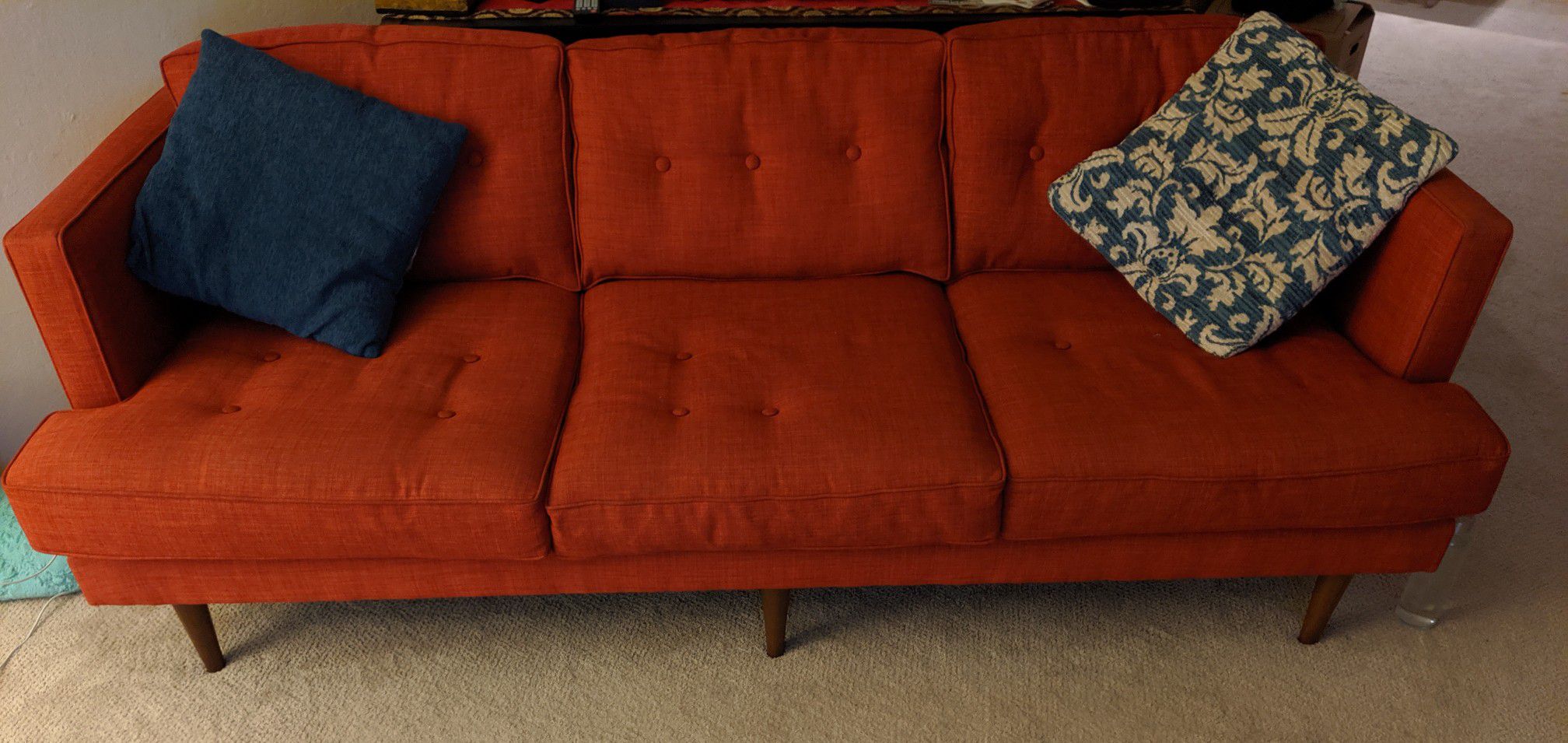 Red three seater accent couch