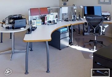 knoll desks, round coffee table and home office setup