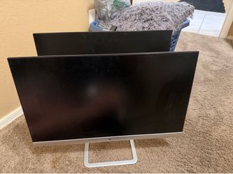 Matching 23” HP monitors. You get both.