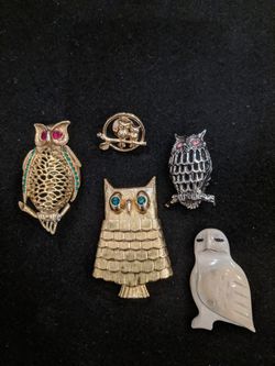 $15. Five vintage owl brooches. One locket is a 1960s Avon lip gloss gold tone with emerald eyes owl locket.