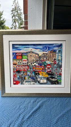 The framed artwork shown in the image is a vibrant cityscape print titled "London" (or "Piccadilly Circus