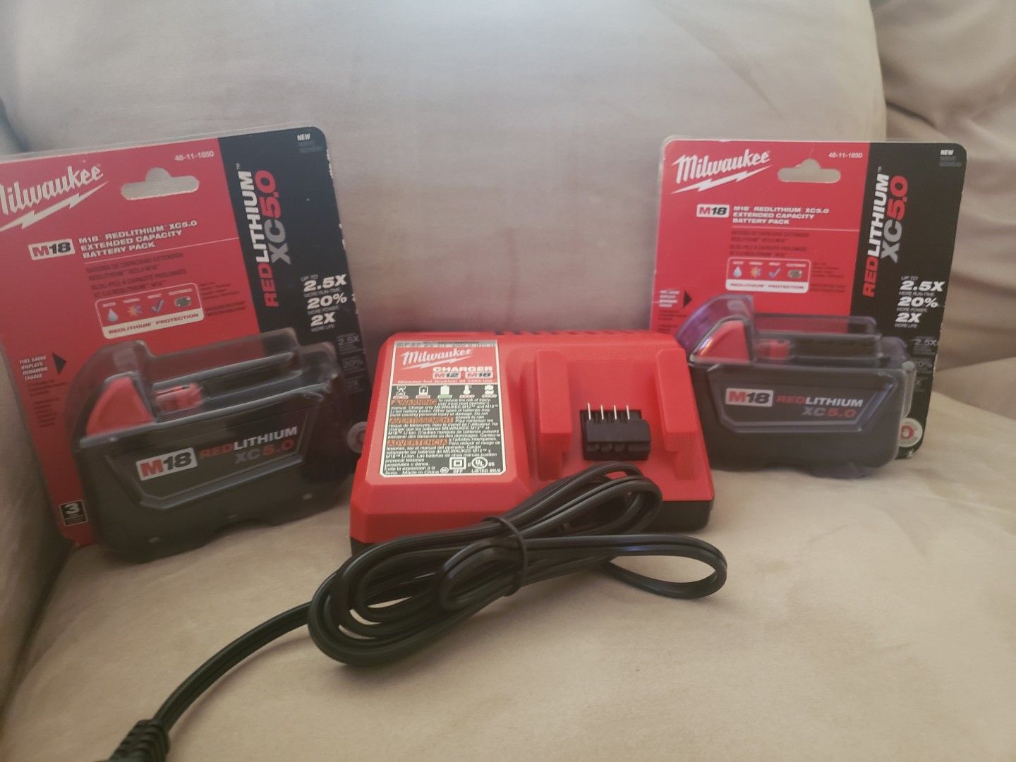 Milwaukee M12 and M18 Charger and Two Milwaukee M18 Red Lithium XC 5.0 Batteries