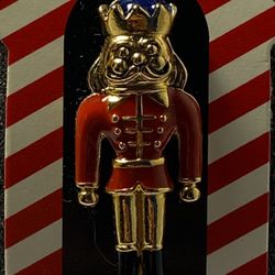 Avon  Toy Soldier  Lapel Pin  Brooch  attached to a card  Nutcracker  King  Faux pearl on top of gold crown   Approx:  1 1/2” TALL  little over 1/2” W