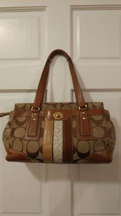 A beautiful Coach purse wallet and make-up bag