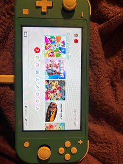 Nintendo Switch Lite Light Blue + 4 Games + 2 Controllers