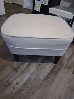 Upholstered Ottoman with Dark Wood Legs