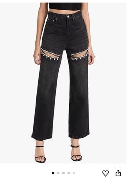 Women's high-waisted, wide-leg jeans featuring dazzling rhinestone embellishments and stylish cut-out rips.