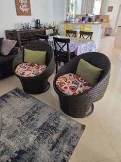 2 Wicker Swivel Egg Chairs with Cushions – Indoor/Outdoor – $180