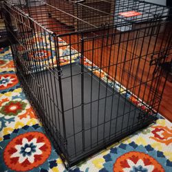Collapsible metal dog crate, New.
