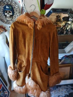 vintage Penny Lane style jacket, featuring brown leather and faux fur trim.