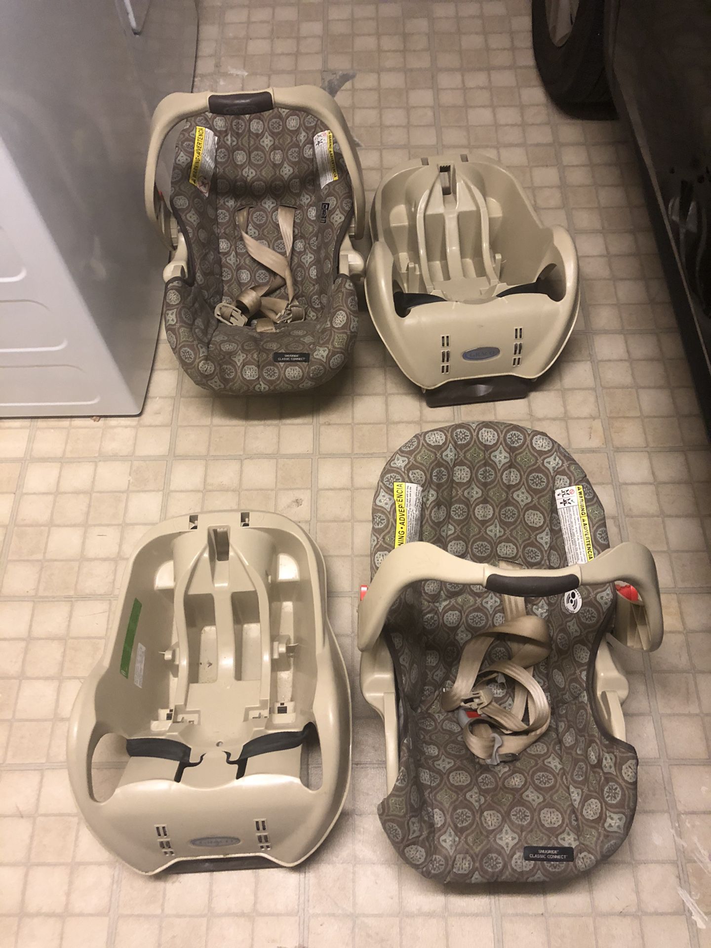 Two Graco Infant car seats with base
