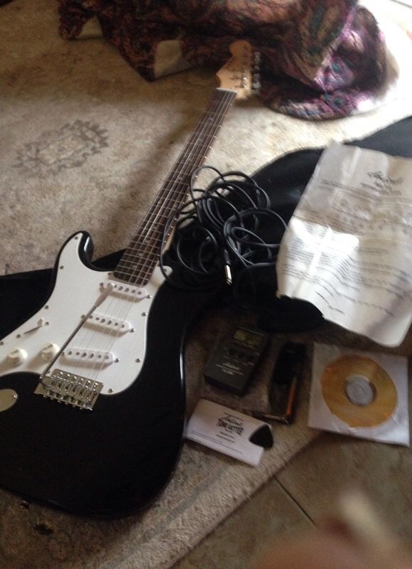 Aria Electric guitar with cloth case,tuner,cord ,pic,and lessons