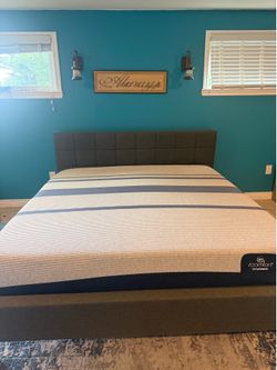 King sized Serta mattress with king upholstered bed frame
