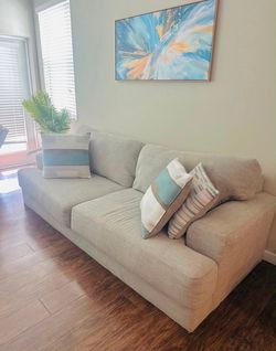Living room couch 🛋️ framed wall art included
