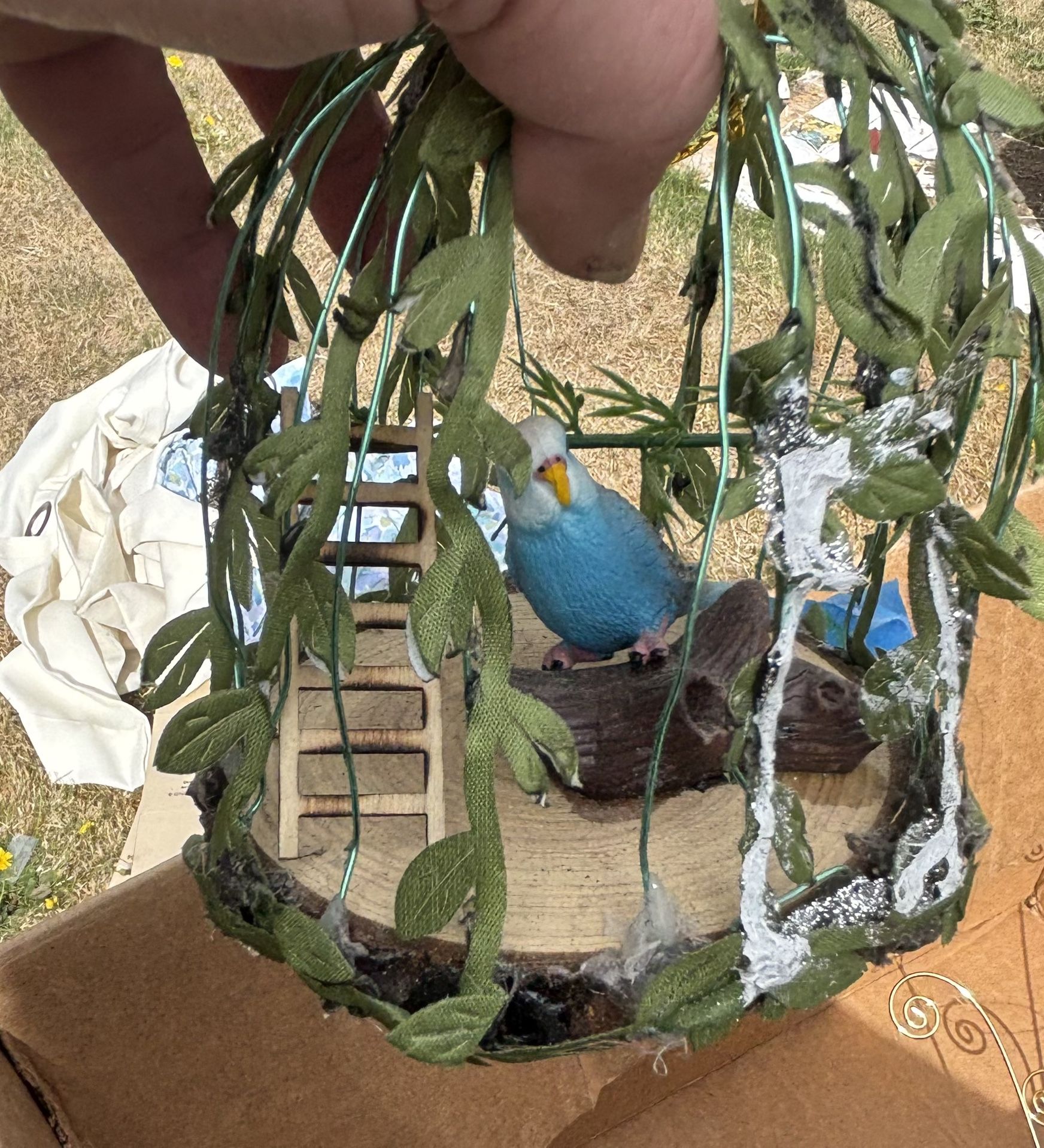Two Birdhouses With Bird Inside