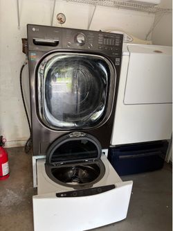 LG front-load washing machine equipped with a Sidekick pedestal washer in the bottom drawer