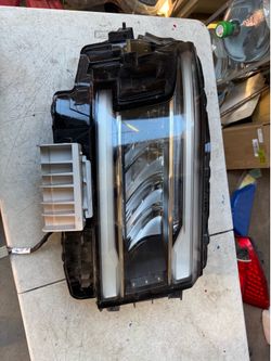 Nissan frontier Right Headlight lid Oem