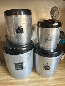 VINTAGE WESTBEND ALUMINUM FOUR PIECE CANISTER SET SILVER WITH BLACK PATTERNS