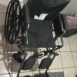 Wheelchair with leg rest/pads
