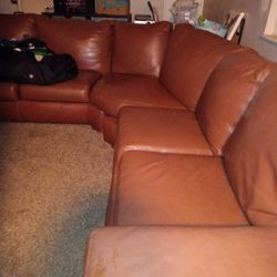 Brown Leather Sectional Couch For $250.00