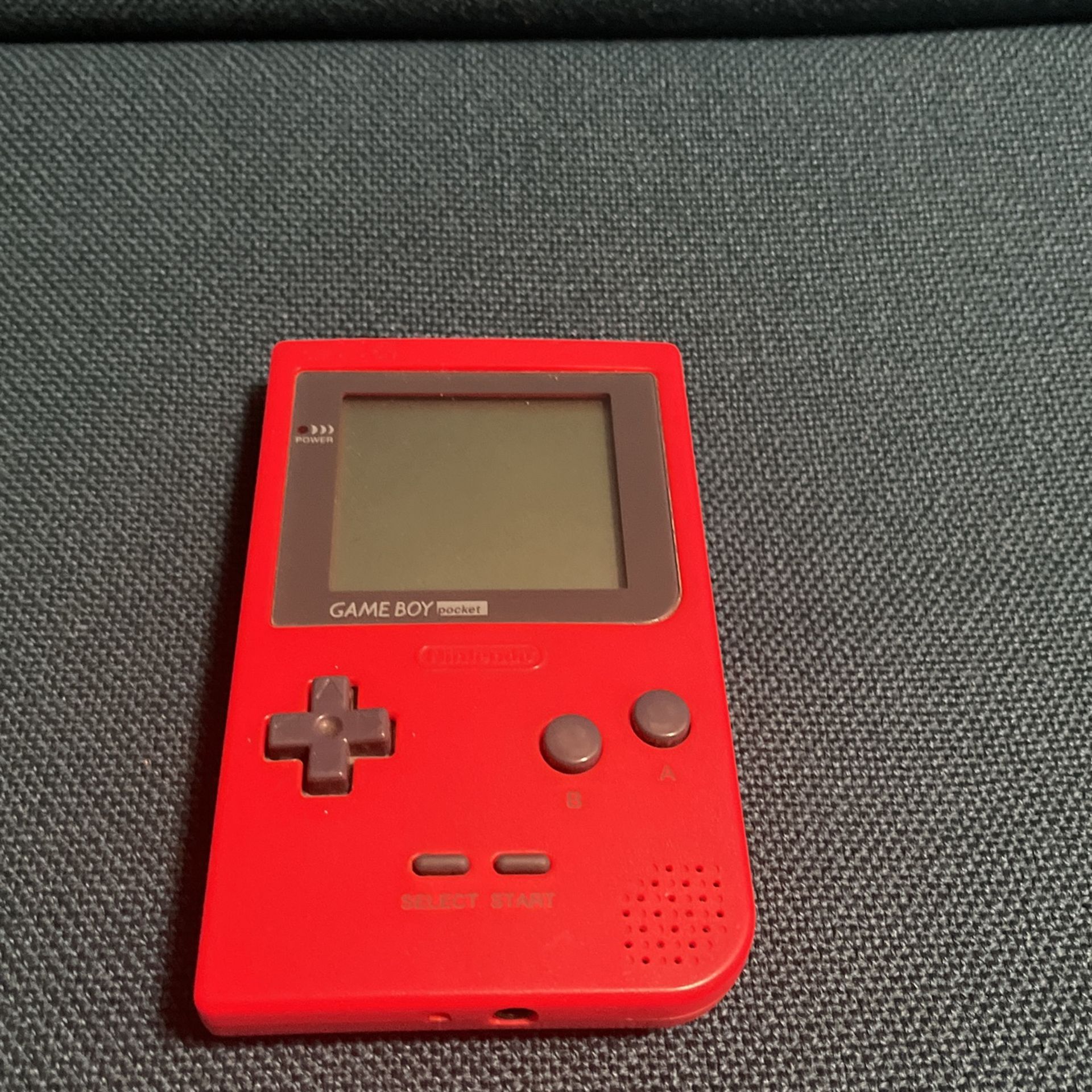 Red Nintendo Gameboy With Game