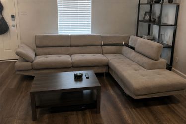 Free Delivery Today! Steam cleaned ! Modern Sectional with adjustable headrest/armrest and STORAGE.  No rips or stains ! Beautiful sofa