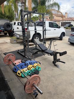 Smith machine with pulley plus 7ft 45lbs bar and 345lbs of Olympic weights and weight tree