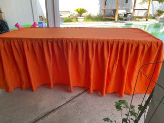 Orange drape table cloth 6’ table