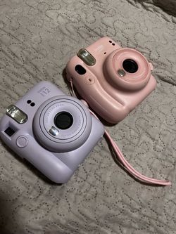 2 polaroid cameras