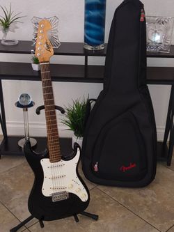 Lyon by Washburn electric guitar and gig bag case