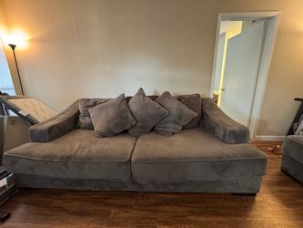 Brown couch with love seat