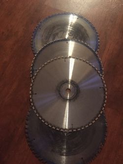 4 saw blades (used) Avanti pro 10 in. X 60 tooth fine finish saw blades (4 pack)