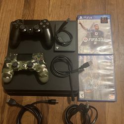 PS4 Slim, Game Drive for PS4 2 TB, 2 Controllers, 2 Games, And All Cables.