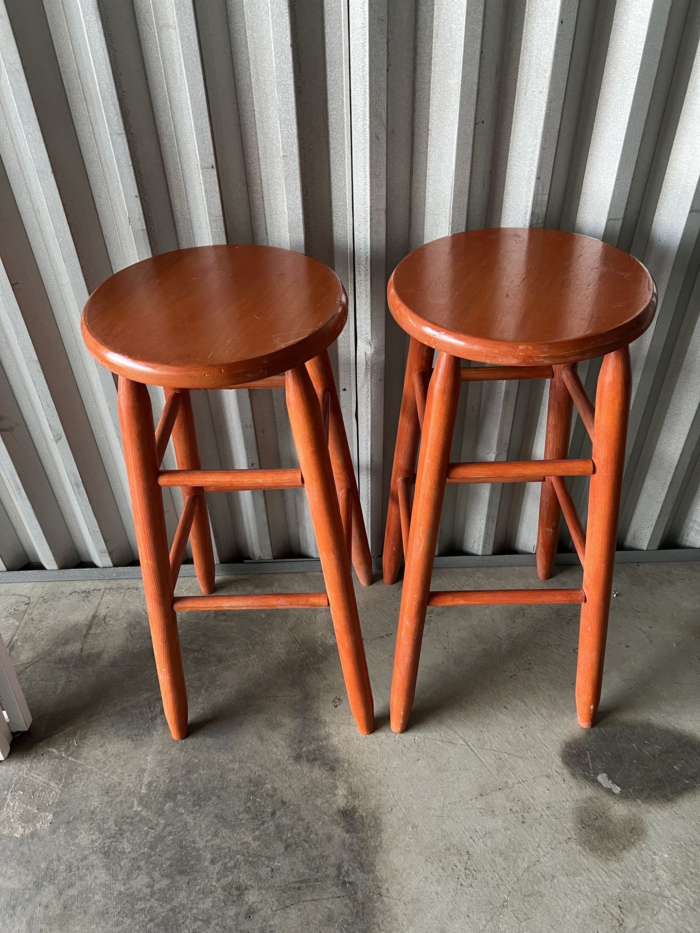2 burnt orange stools