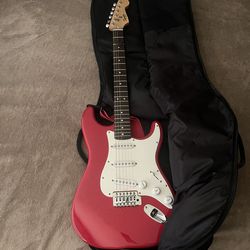Red Electric Guitar Squier Stratocaster