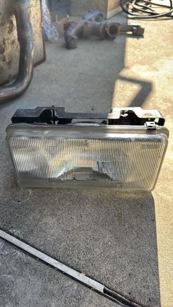 1(contact info removed) Cadillac brougham left side head light