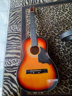 vintage Harmony Model 0401MHU 3/4-size parlor acoustic guitar.