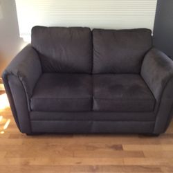 Nearly New Grey Loveseat  60in Wide 36in High  Cushions Are 25in Deep