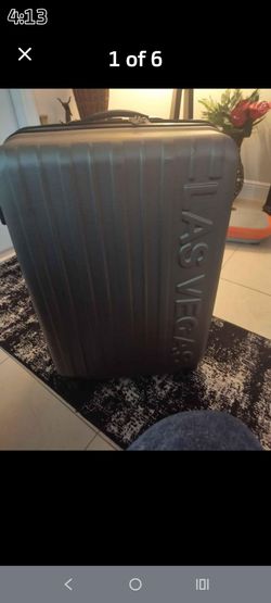 Polycarbonate hardside suitcase that features a large "LAS VEGAS" graphic text! Very big! measures 27 x 19 x 12.25 inches of packing space.USED!!!!