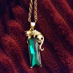 Leopard Pouncing on Emerald Necklace