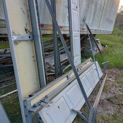 Two Complete Garage Door Assemblies 