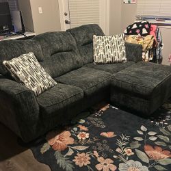 Black and grey Couch And Ottoman 