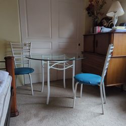 Round Glass Top Dinette Set With Two Cushioned Chairs