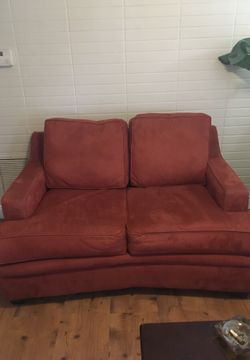 Loveseat in good condition have a few paint spots very solid no cuts or tears