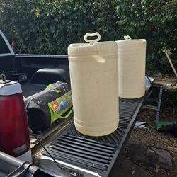 Two water jugs. Not sure.What size they are?Guess in ten gallon. One is missing though top cap