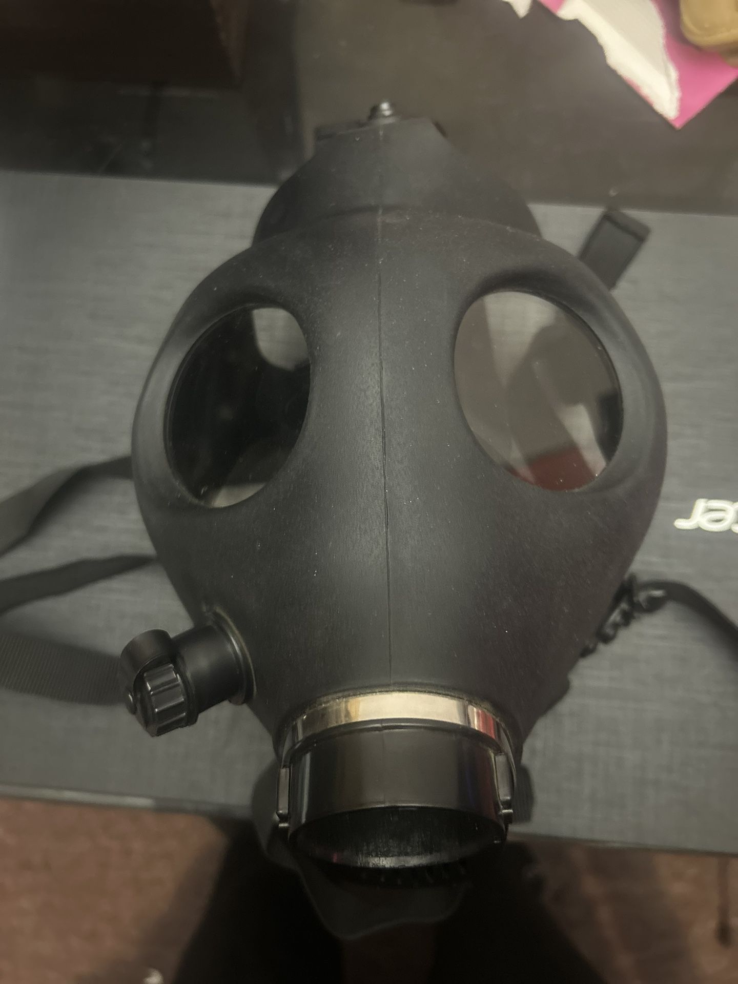 Gas mask with adjustable straps. 
