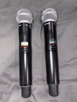 Shure ULXD2 digital handheld wireless microphone transmitter with an SM58 capsule.