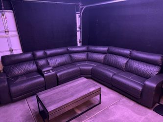 Sectional with 3 recliners and charging ports in middle and on recliners