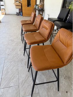 4 orange champagne barstools
