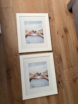 Two white 16x20” picture frames (11x14 with mate)